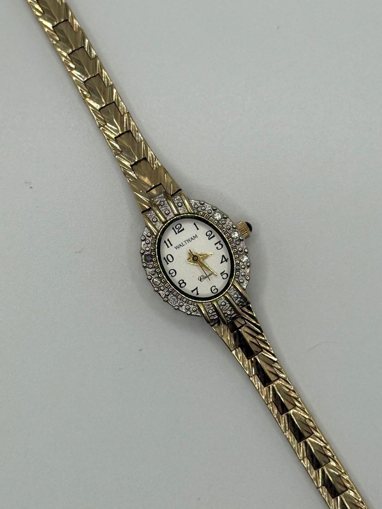 working gold tone diamond bezel watch