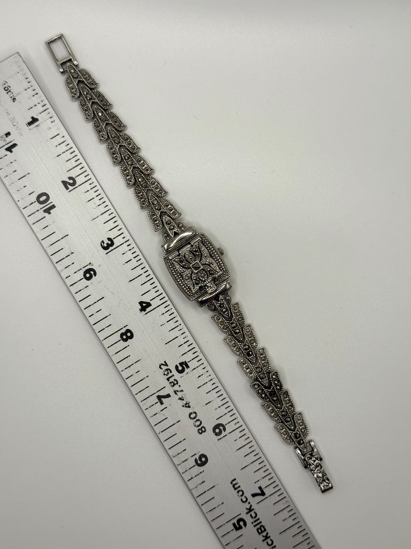 working silver tone marcasite peek a boo watch