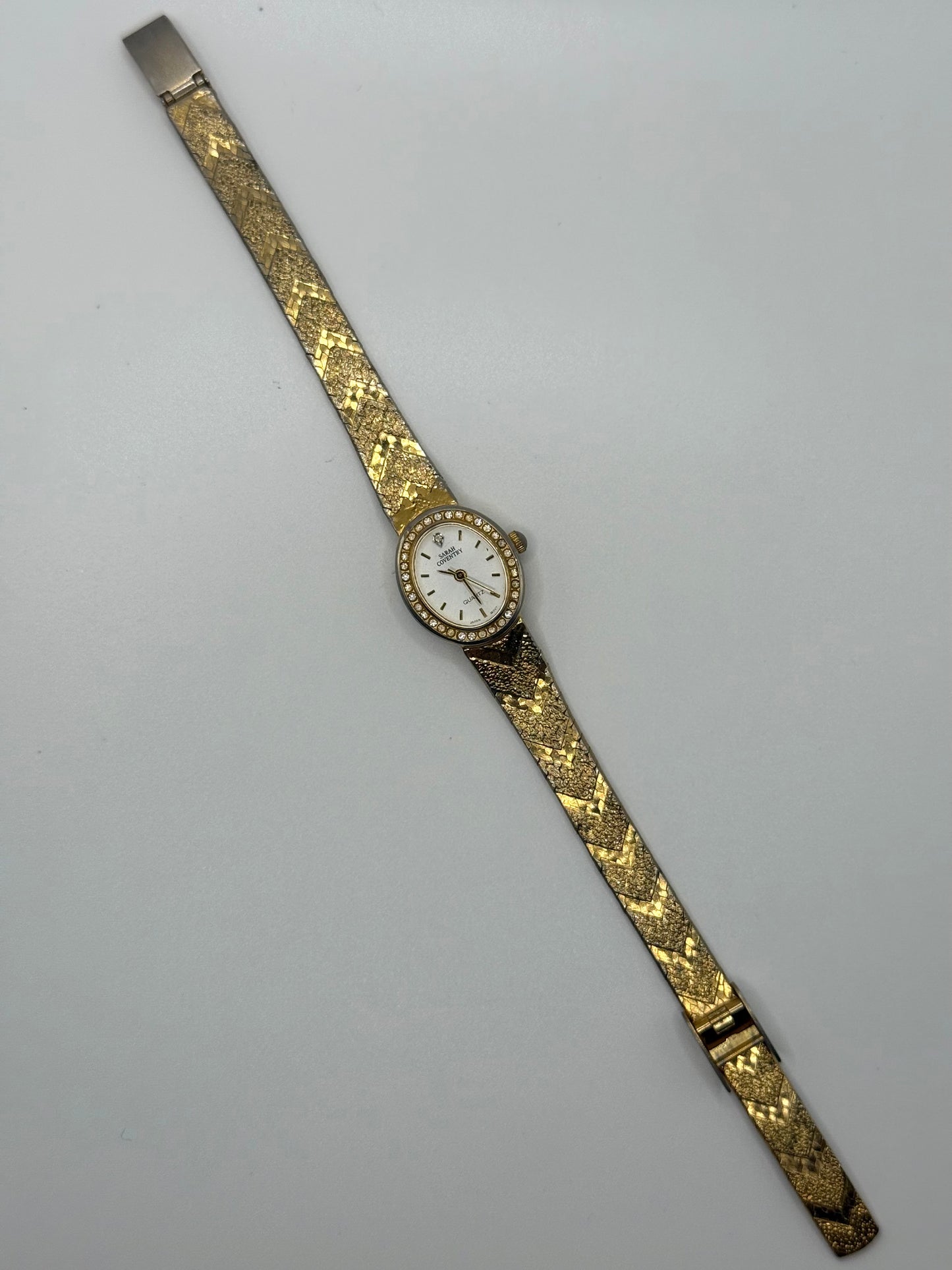 working gold tone crystal bezel watch