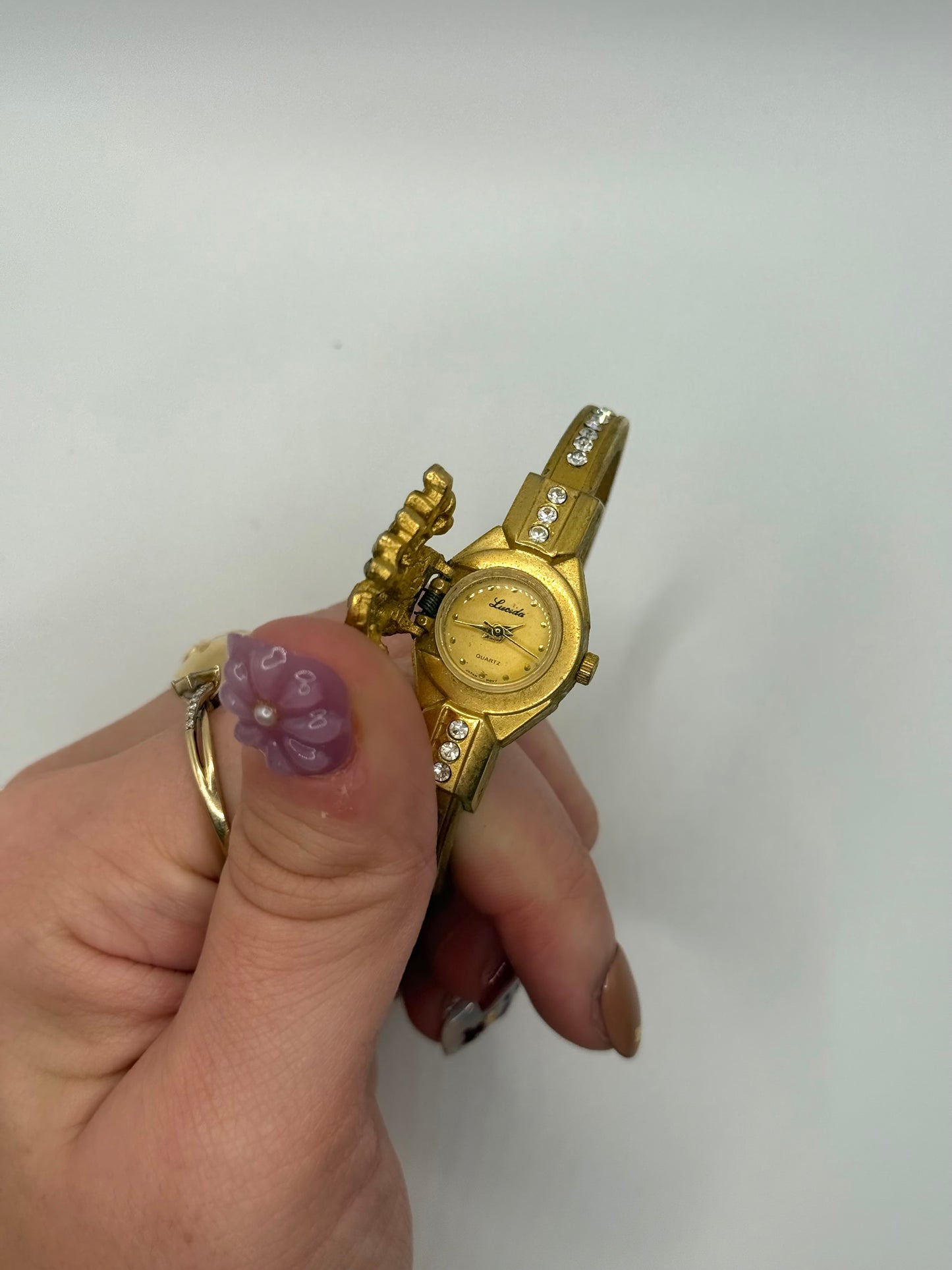 working gold tone peek a boo watch