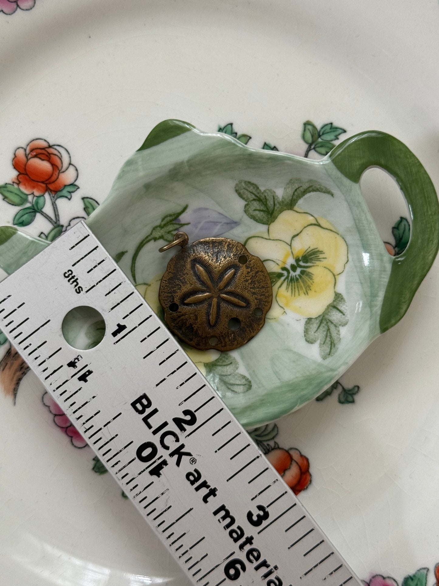 bronze tone sand dollar pendant