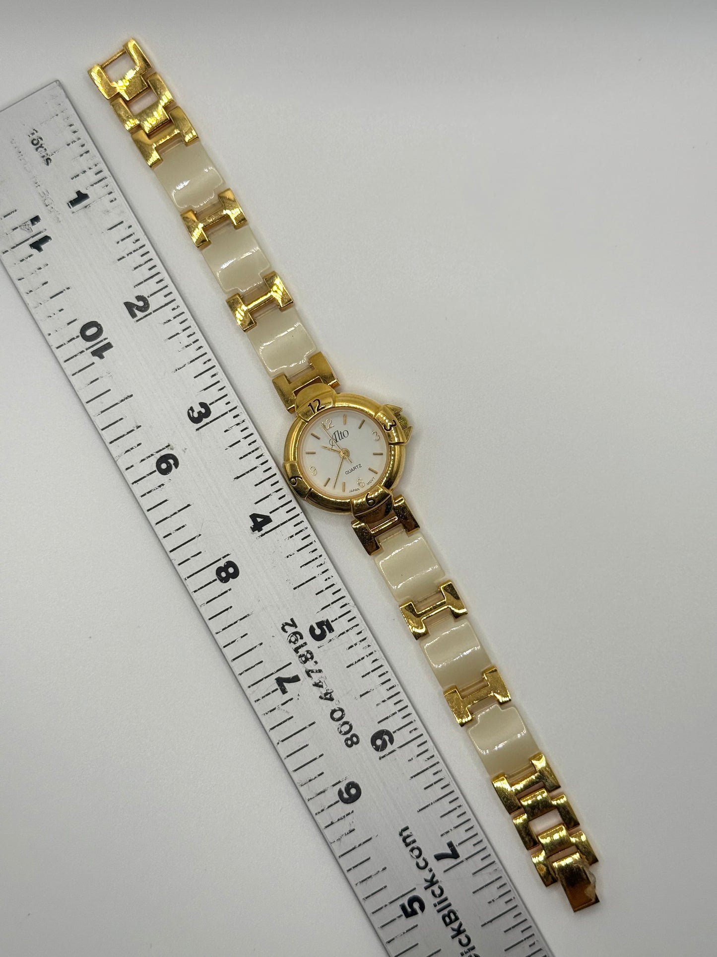 working gold tone panel watch