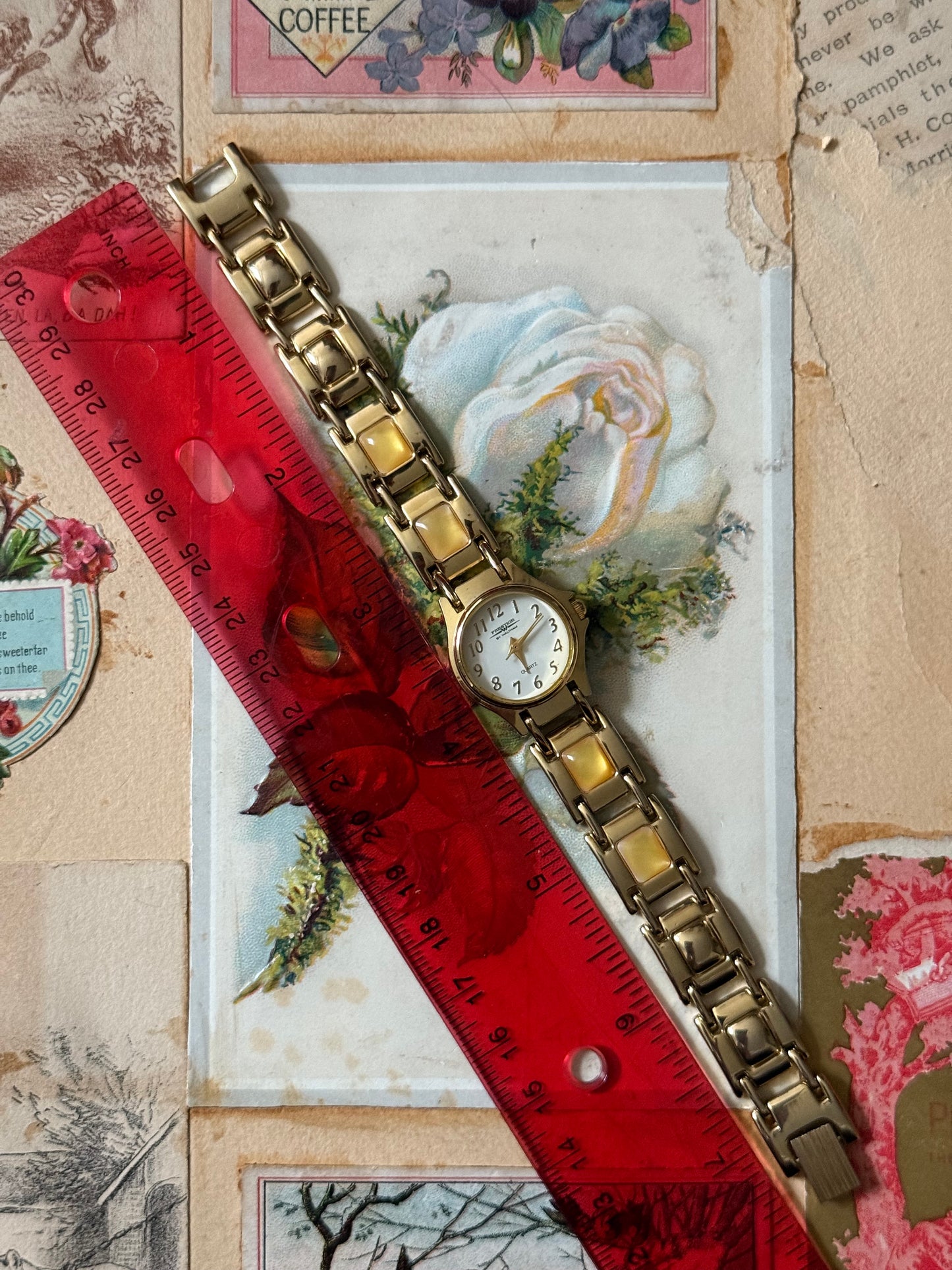 working gold tone gemstone watch
