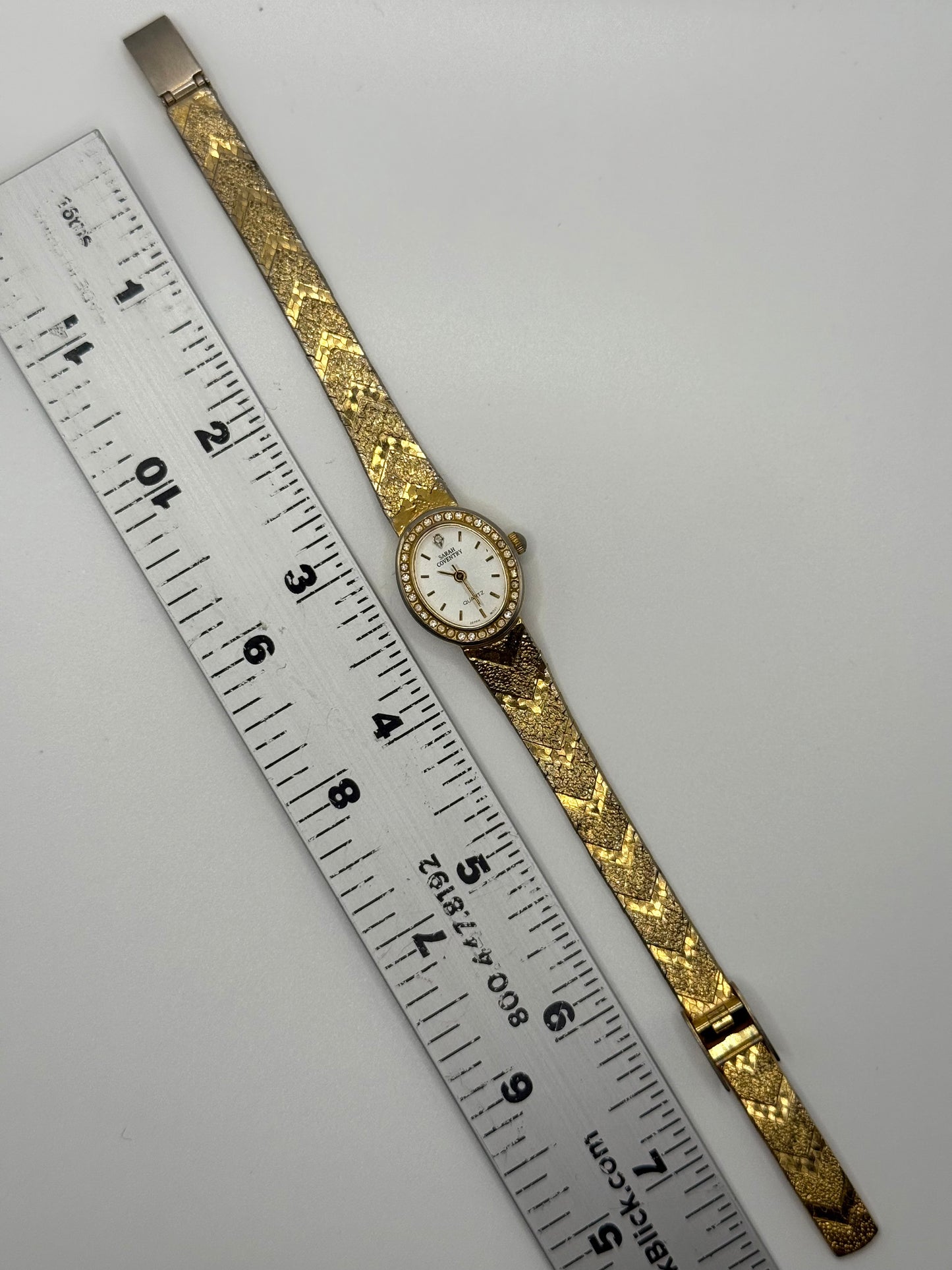 working gold tone crystal bezel watch