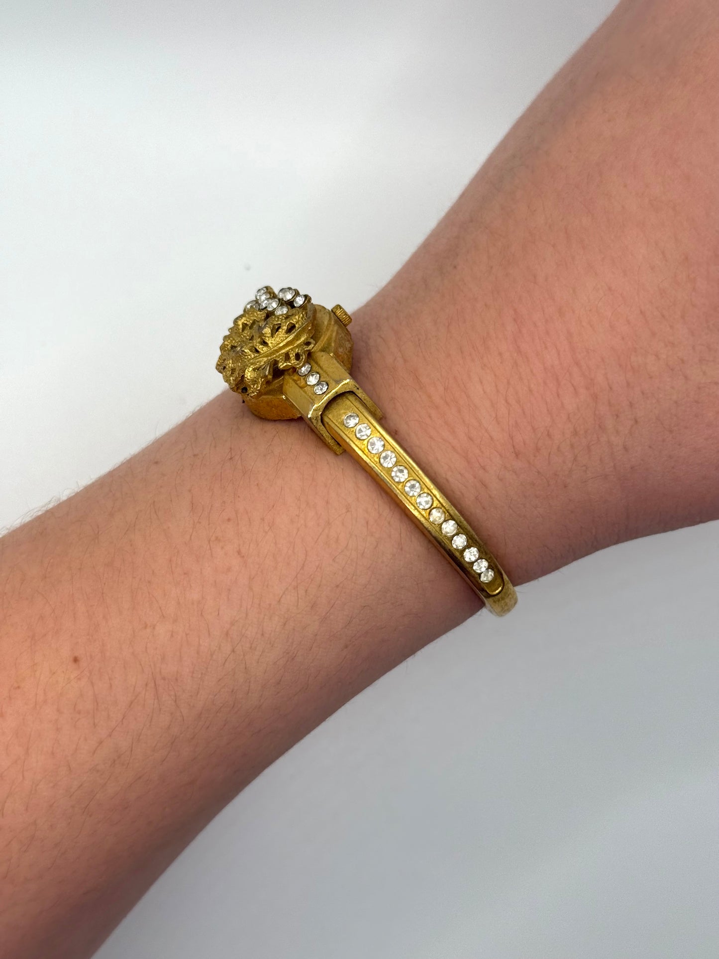 working gold tone peek a boo watch