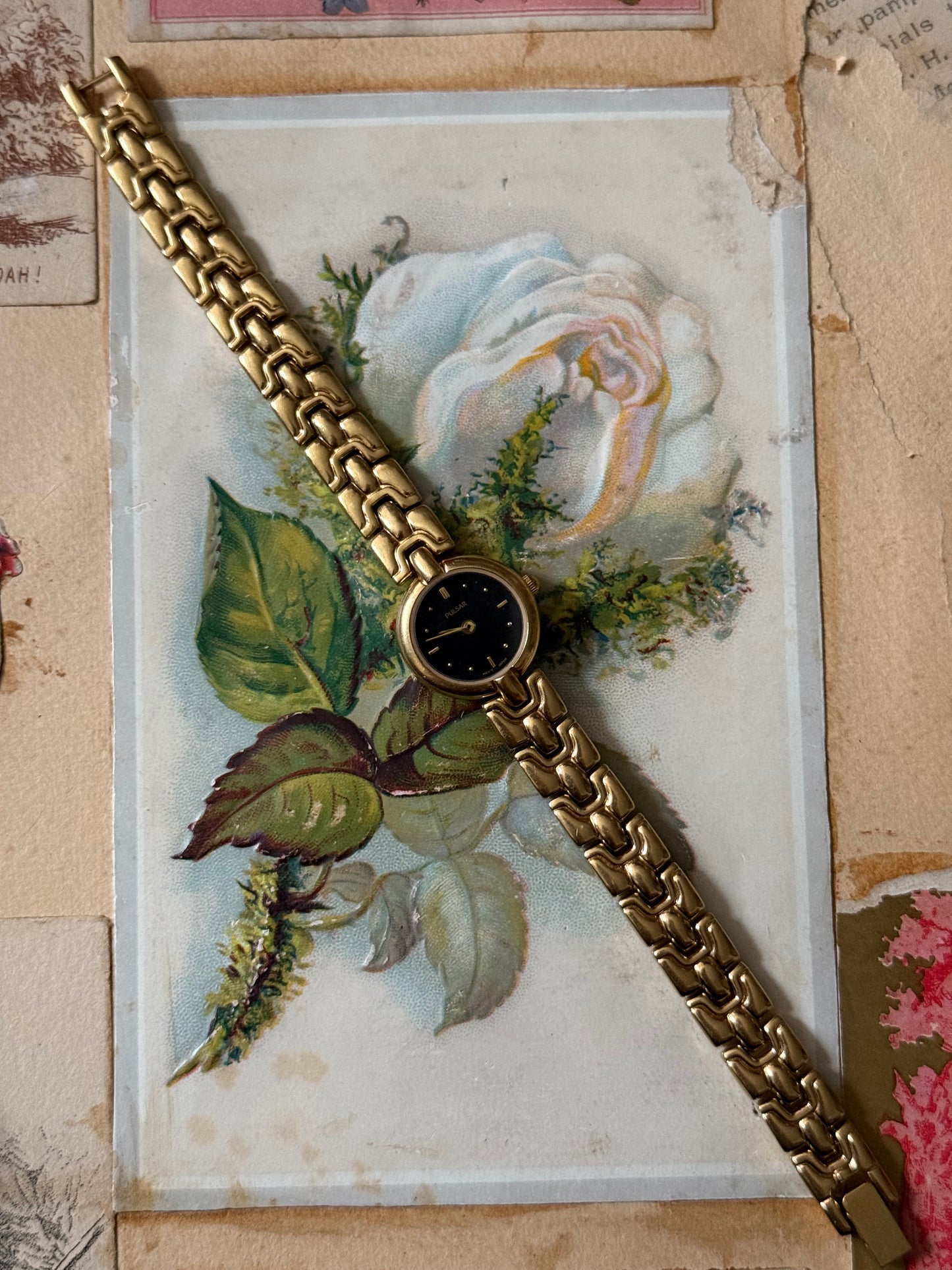 working gold tone black dial watch