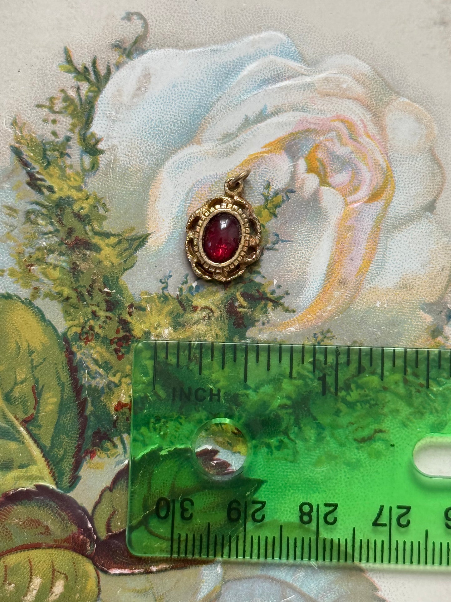 gold tone red gemstone pendant