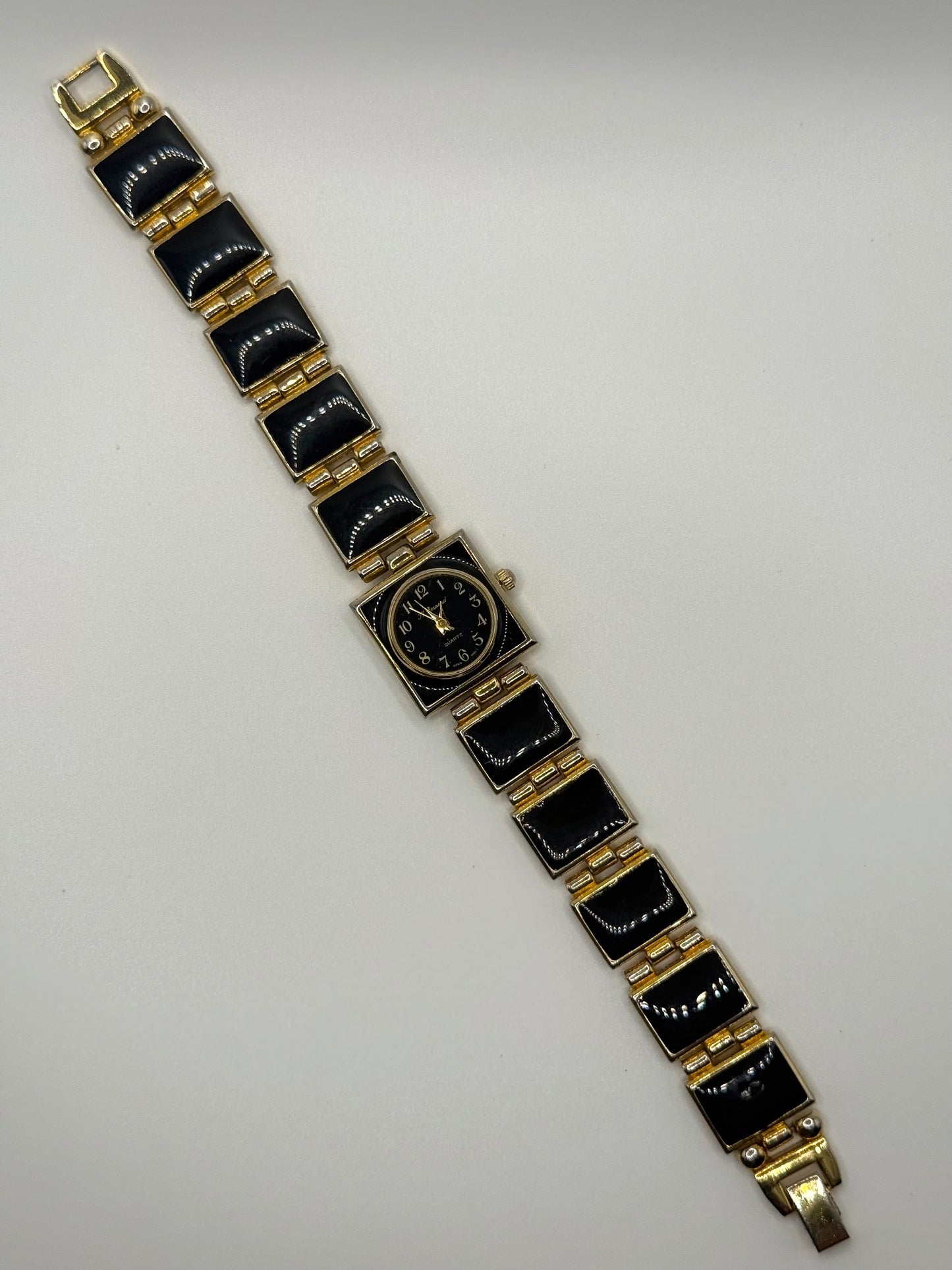 nonworking gold tone black enamel watch