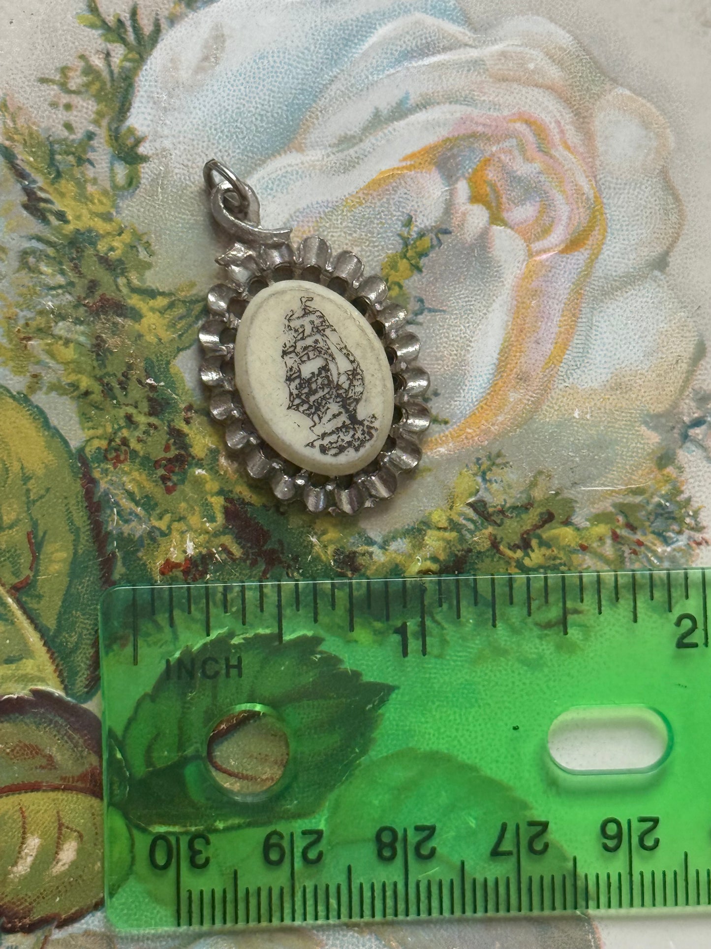 silver tone scrimshaw style ship pendant