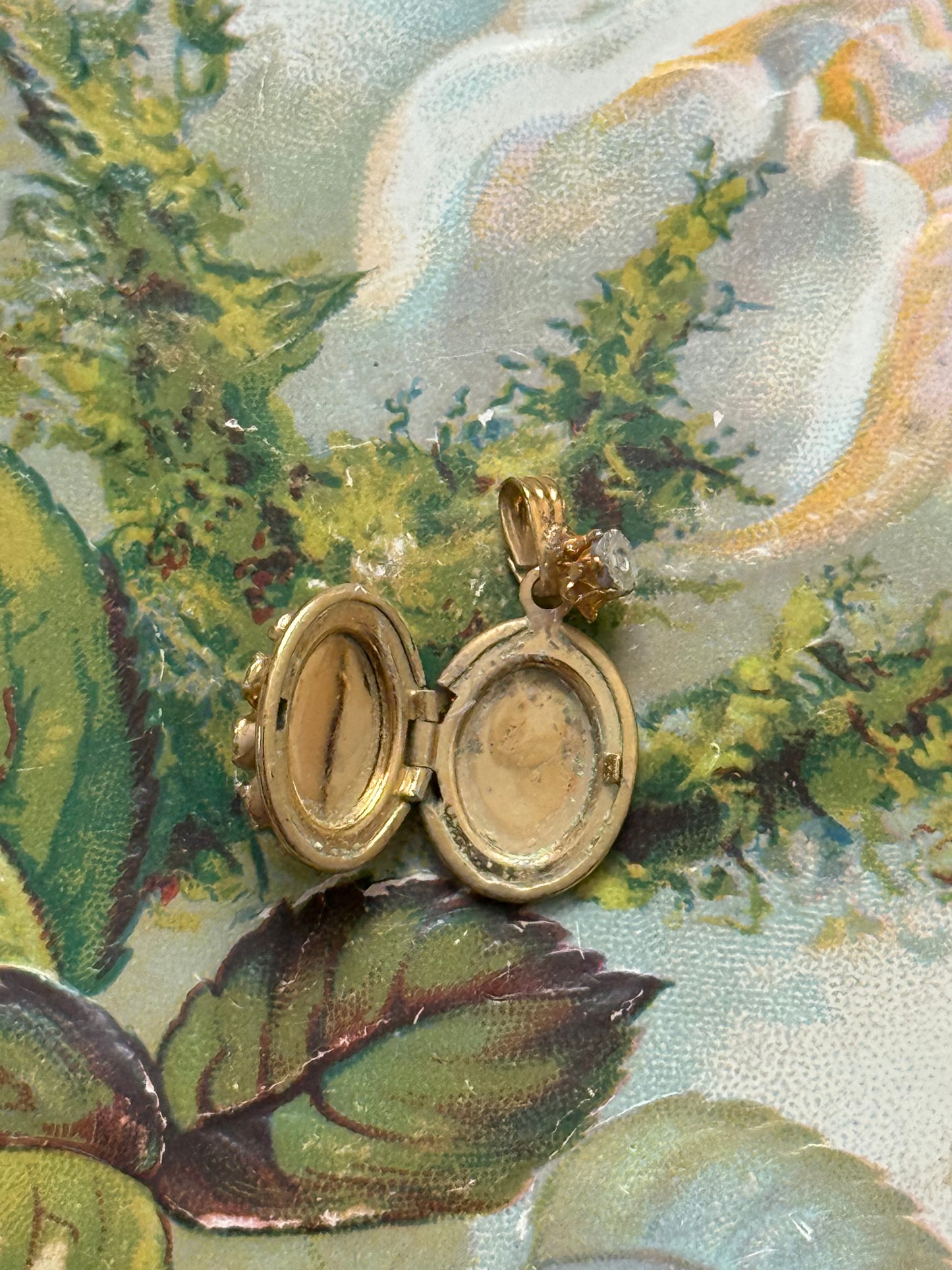 gold tone red gemstone locket pendant