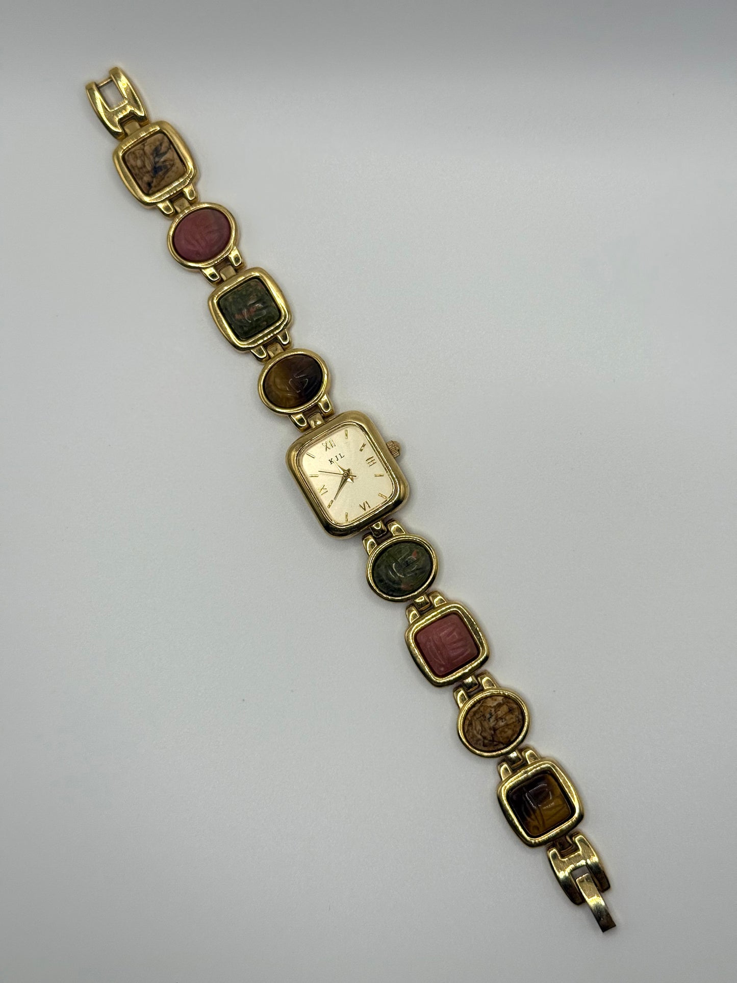 working gold tone Kenneth Jay Lane mauve scarab watch