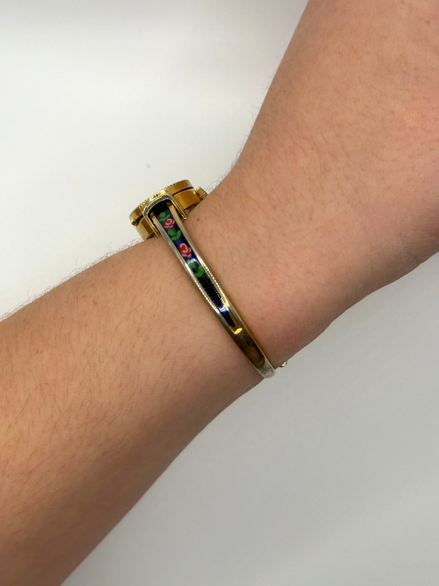 working gold tone wind up floral peek a boo watch