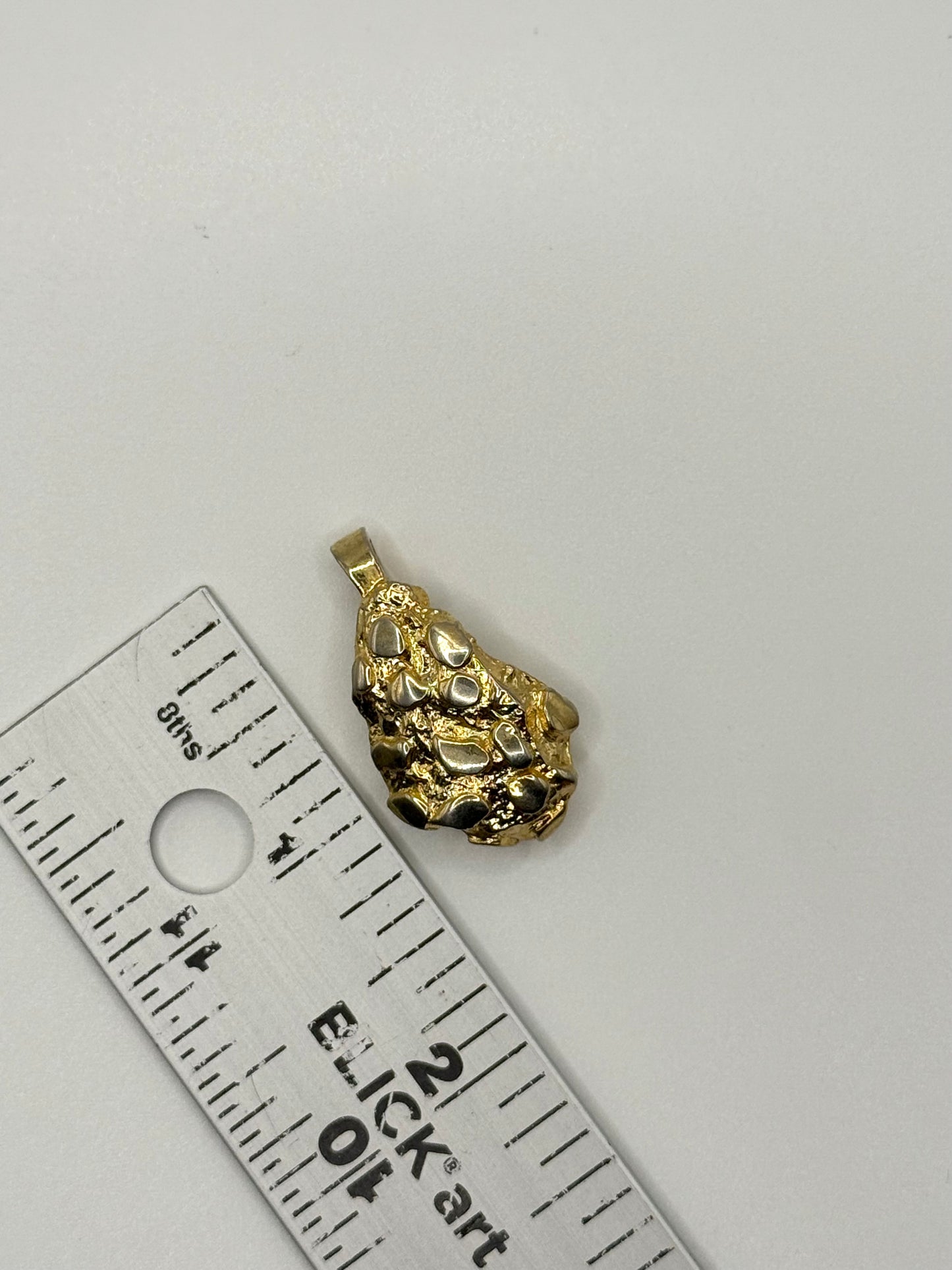 gold tone gold nugget style pendant