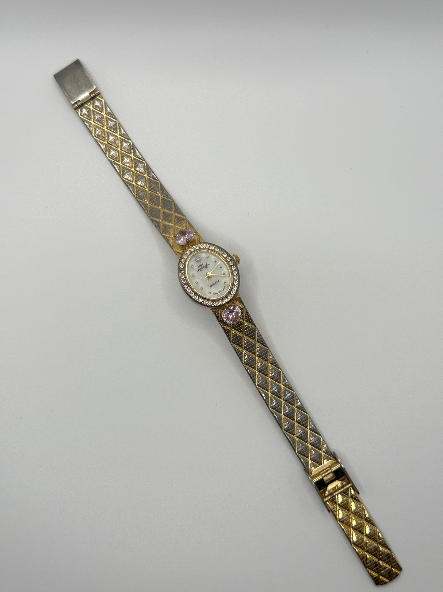 working gold tone pink gemstone watch