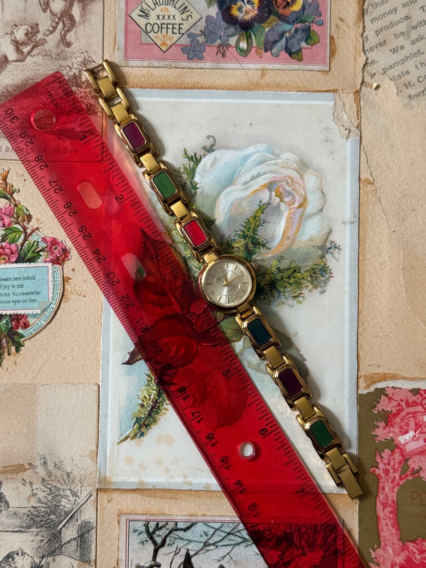 working gold tone enameled gemstone watch