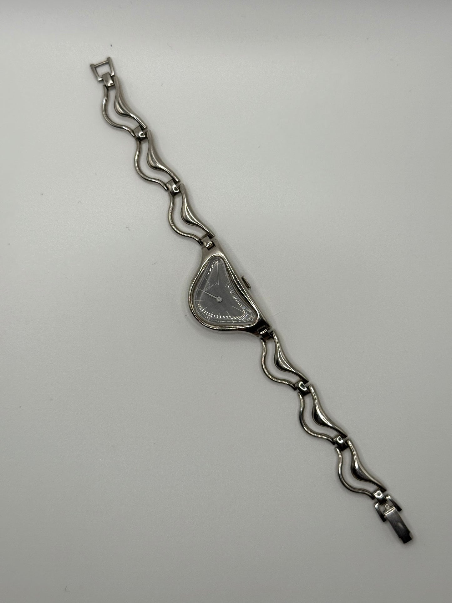 working silver tone wind up half moon watch