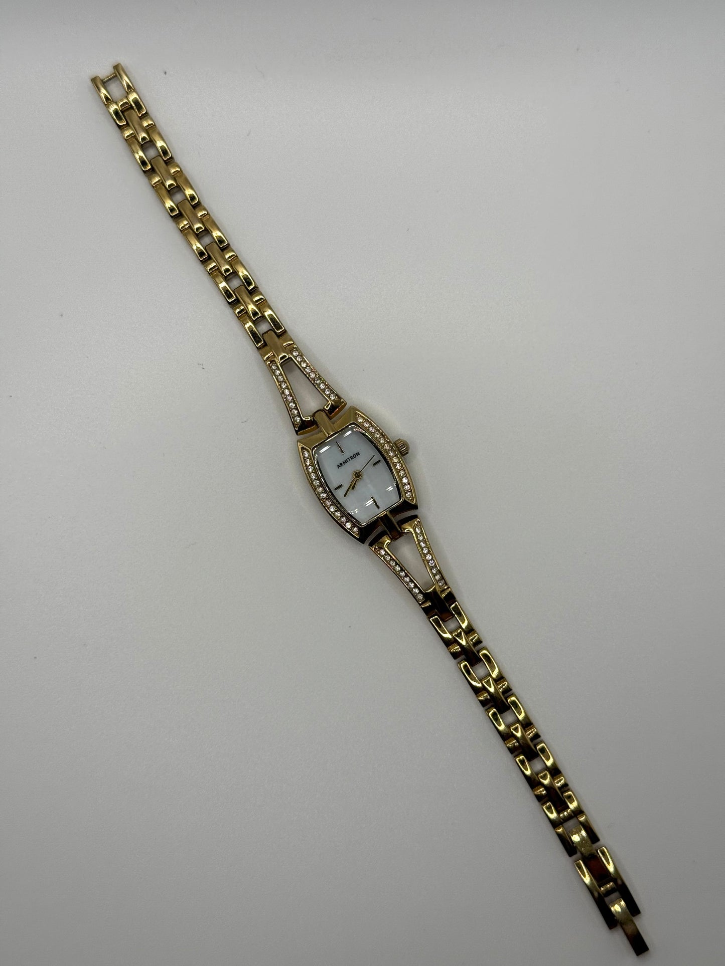 working gold tone crystal bezel watch