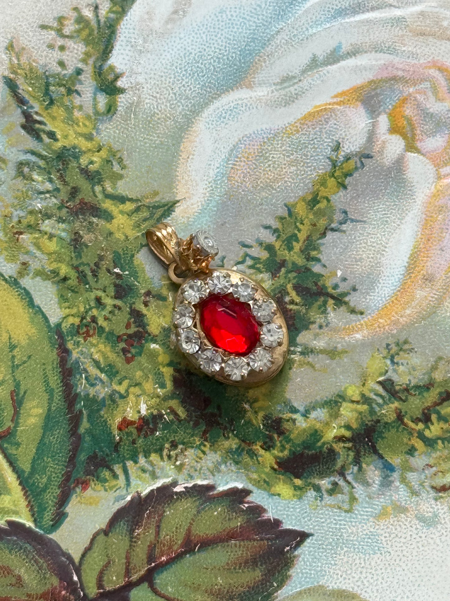 gold tone red gemstone locket pendant