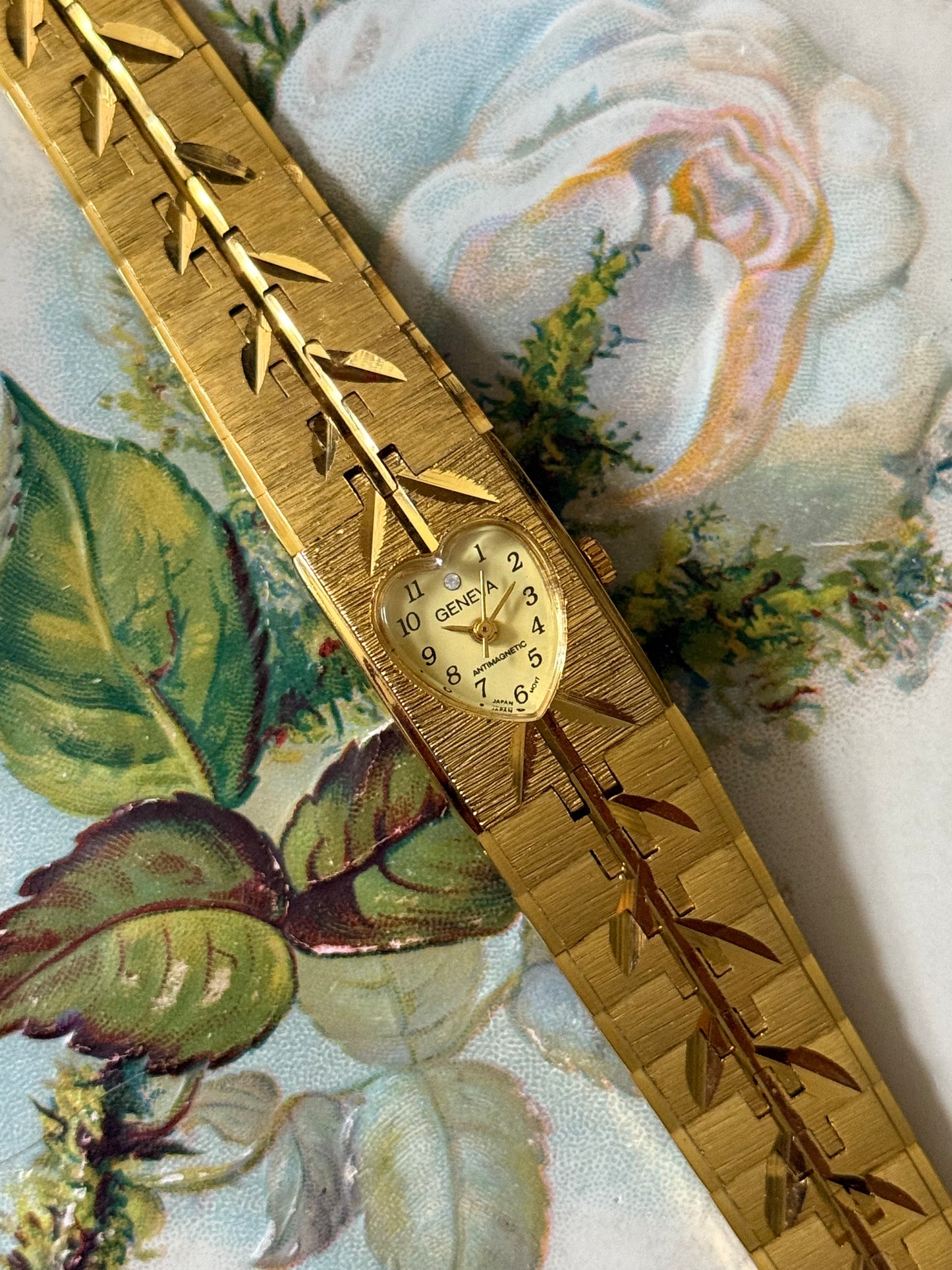 nonworking gold tone heart bezel watch
