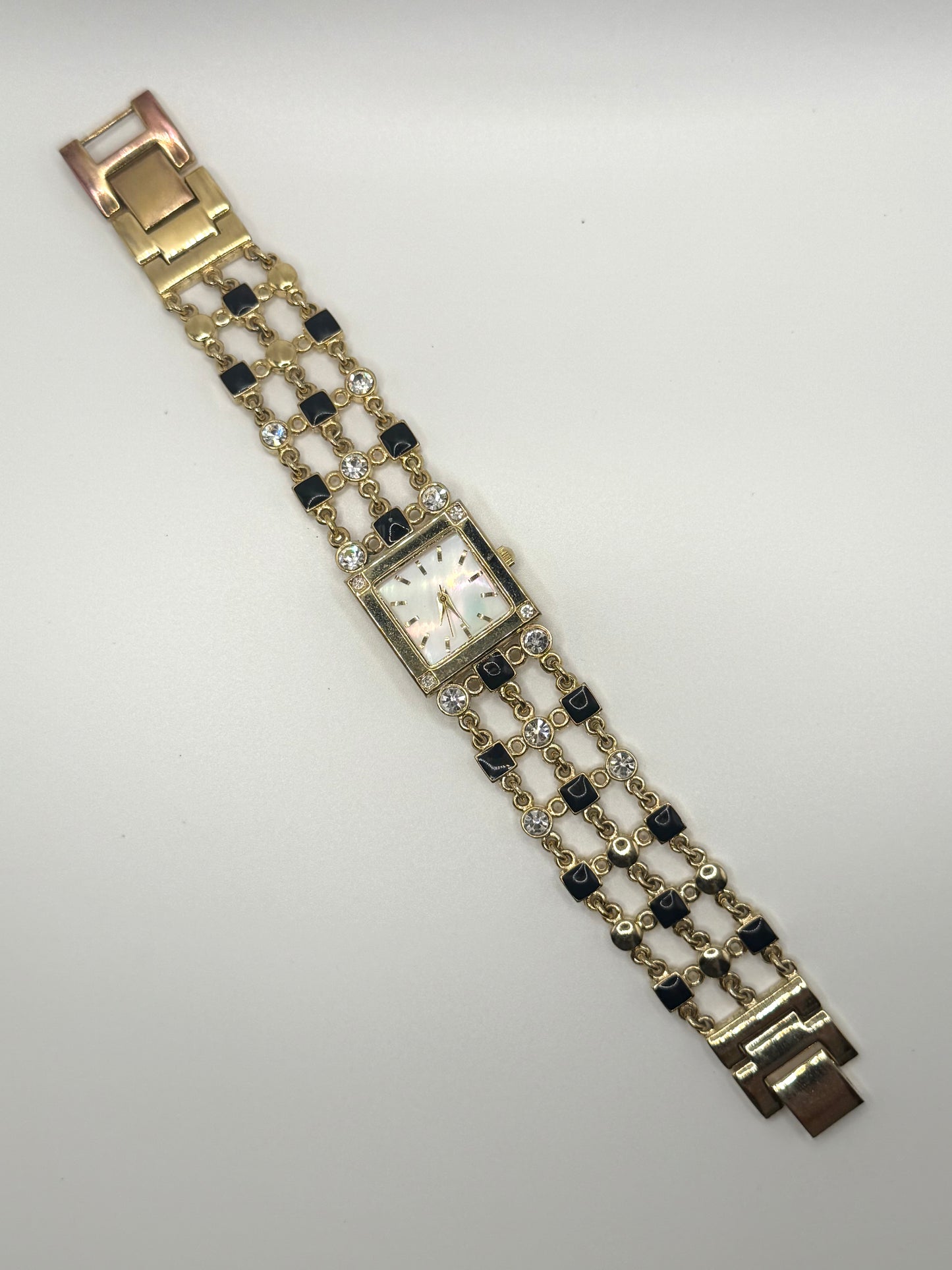 working gold tone black enamel and rhinestone watch