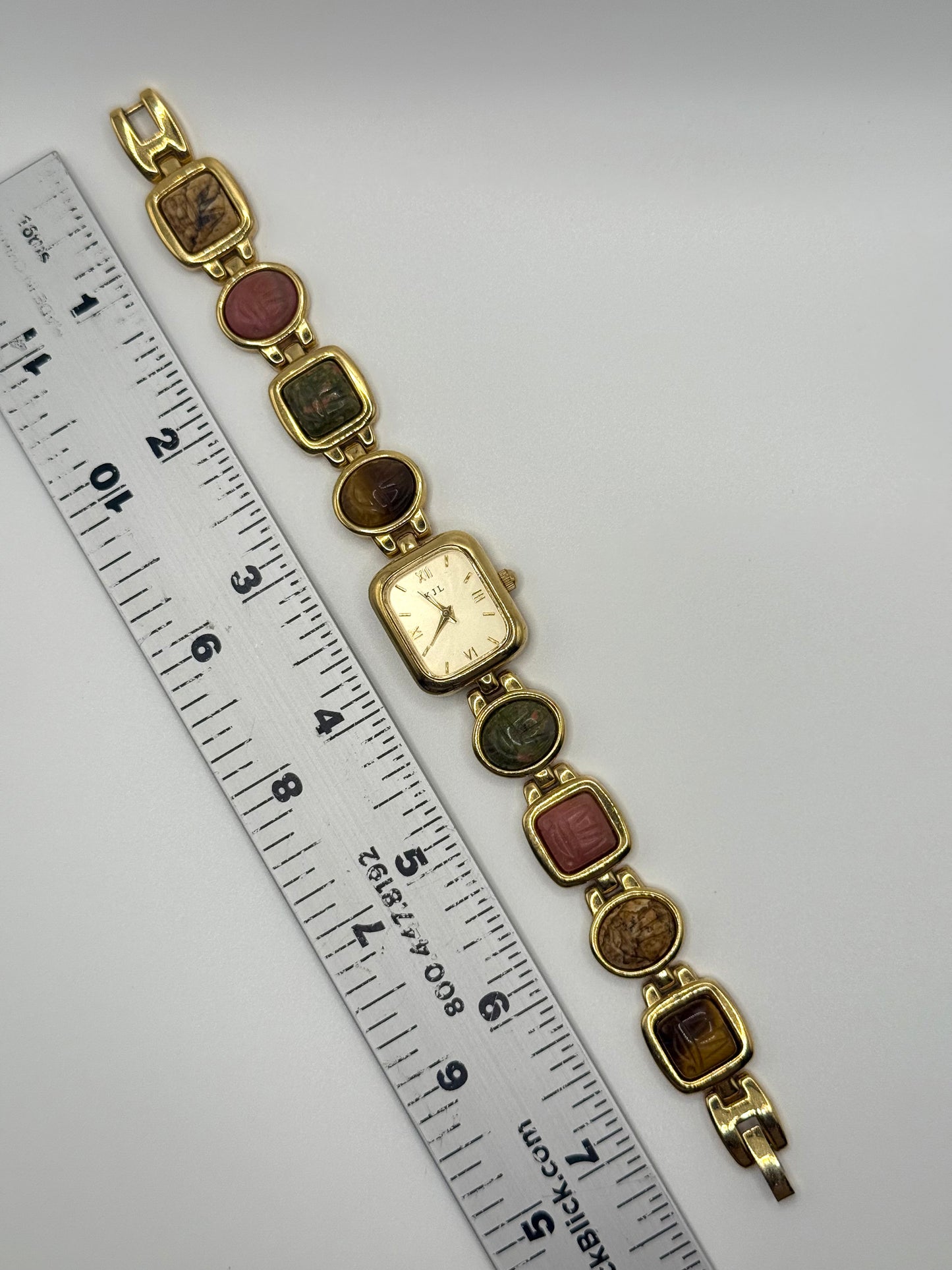 working gold tone Kenneth Jay Lane mauve scarab watch