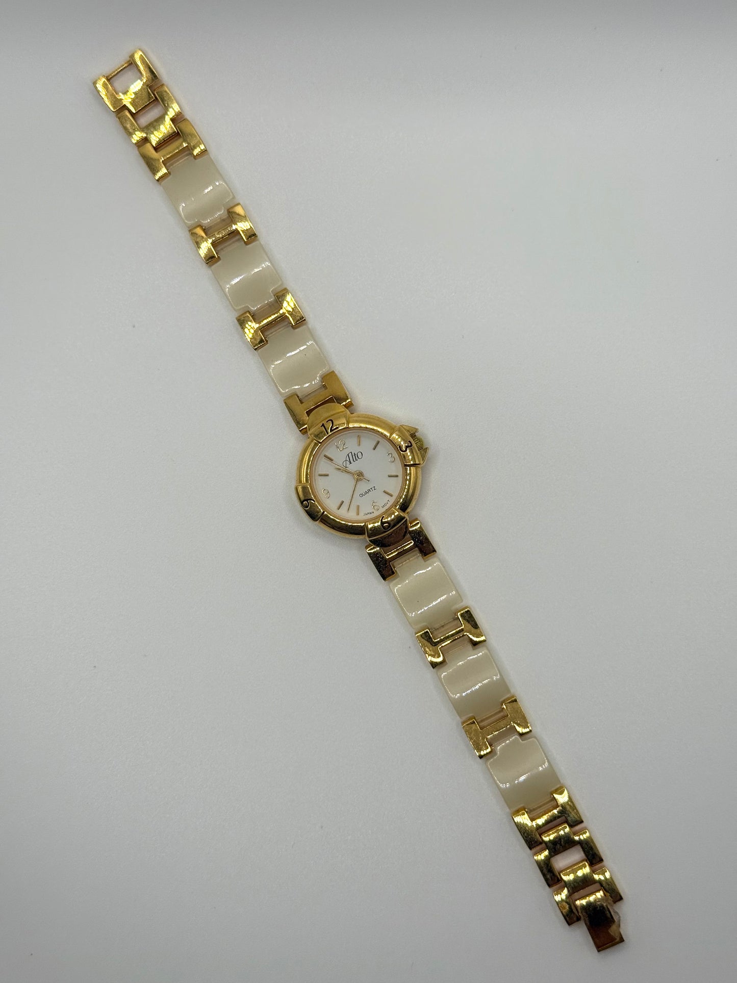 working gold tone panel watch