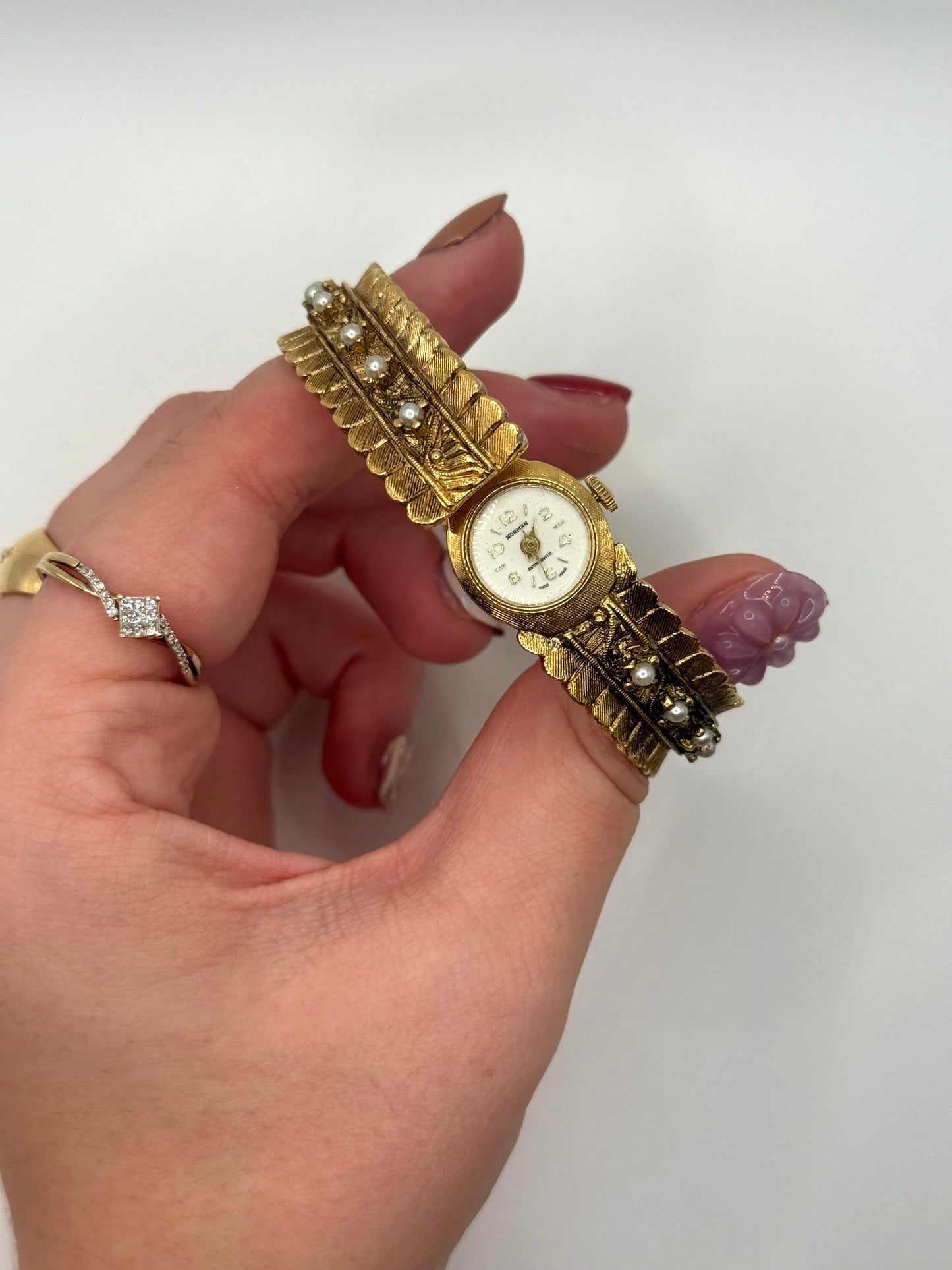 nonworking gold tone pearl band peek a boo watch