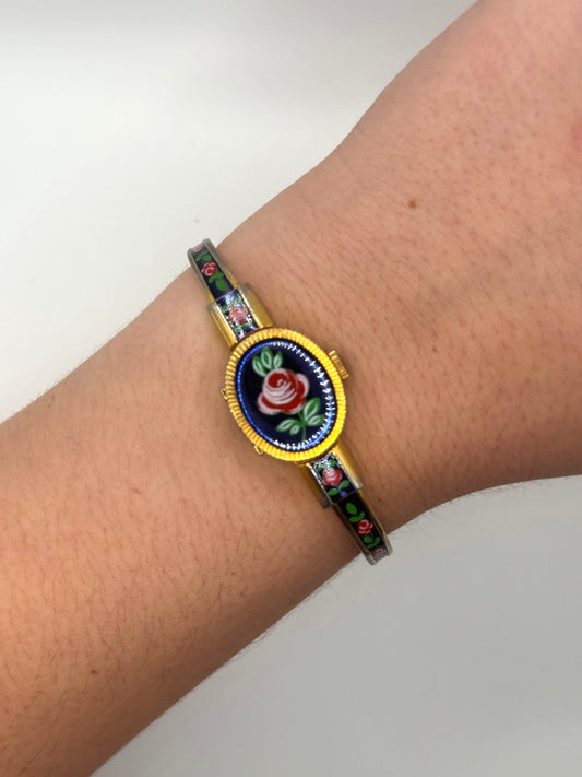 working gold tone wind up floral peek a boo watch