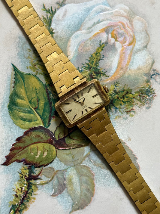 working gold tone rectangle dial wind up watch