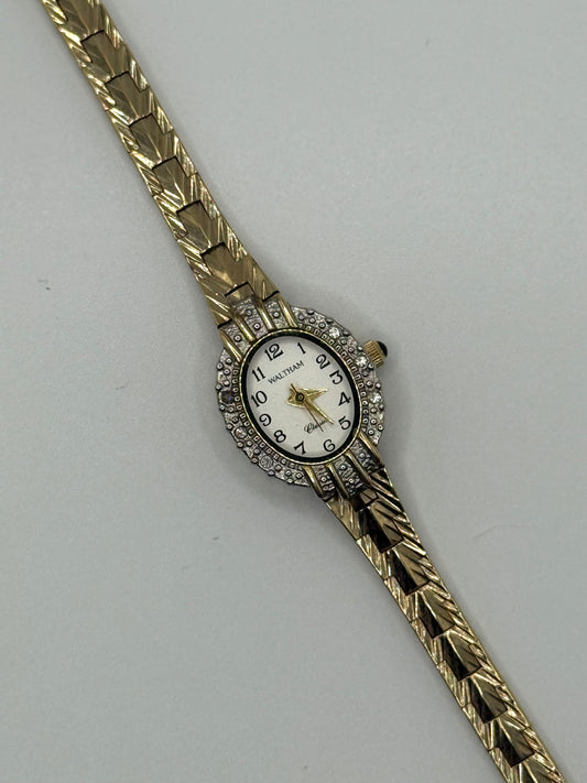 working gold tone diamond bezel watch