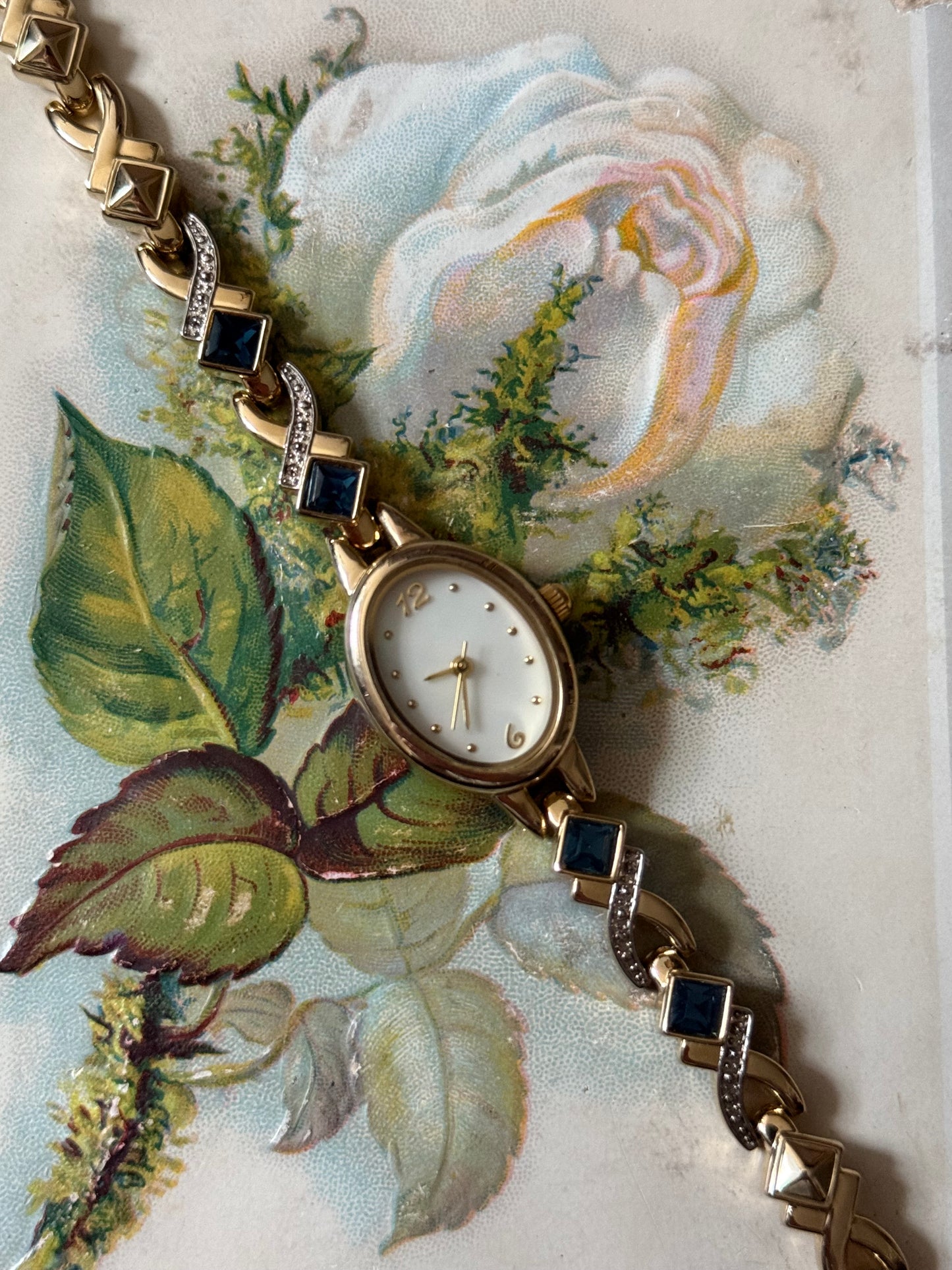working gold tone blue gemstone watch