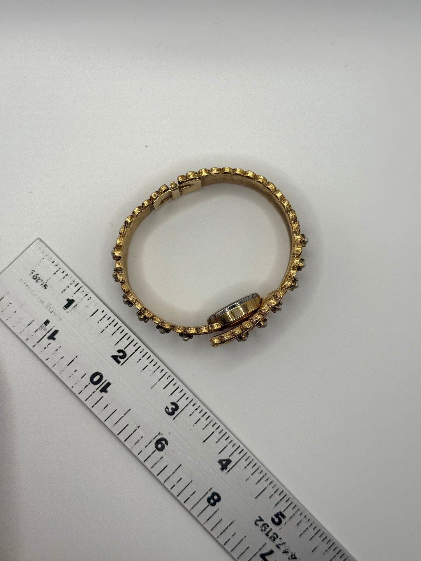 nonworking gold tone pearl band peek a boo watch