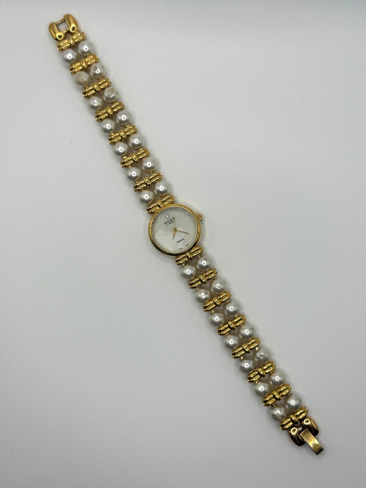 nonworking gold tone pearl band watch