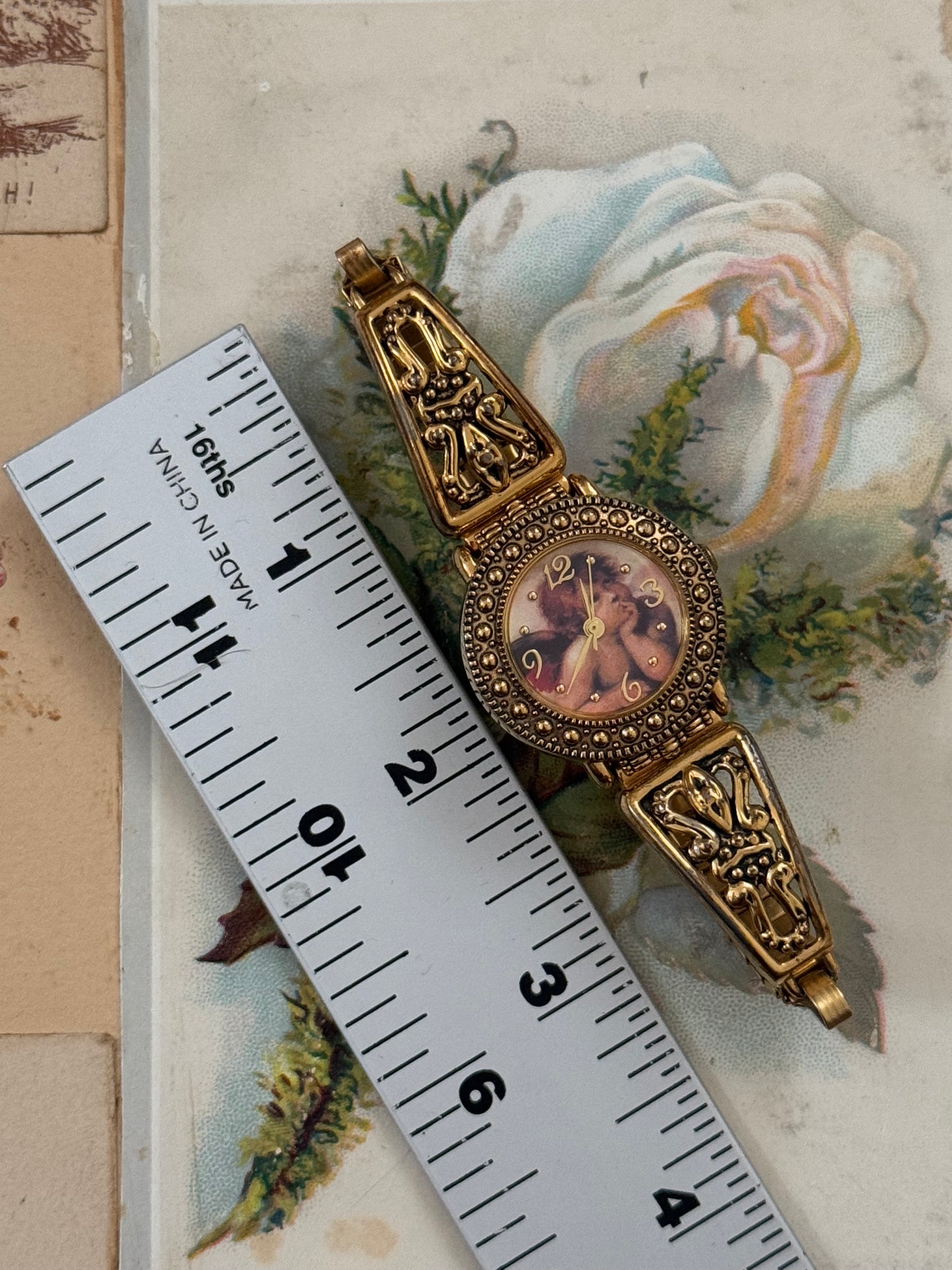 avon gold tone vintage cherub watch