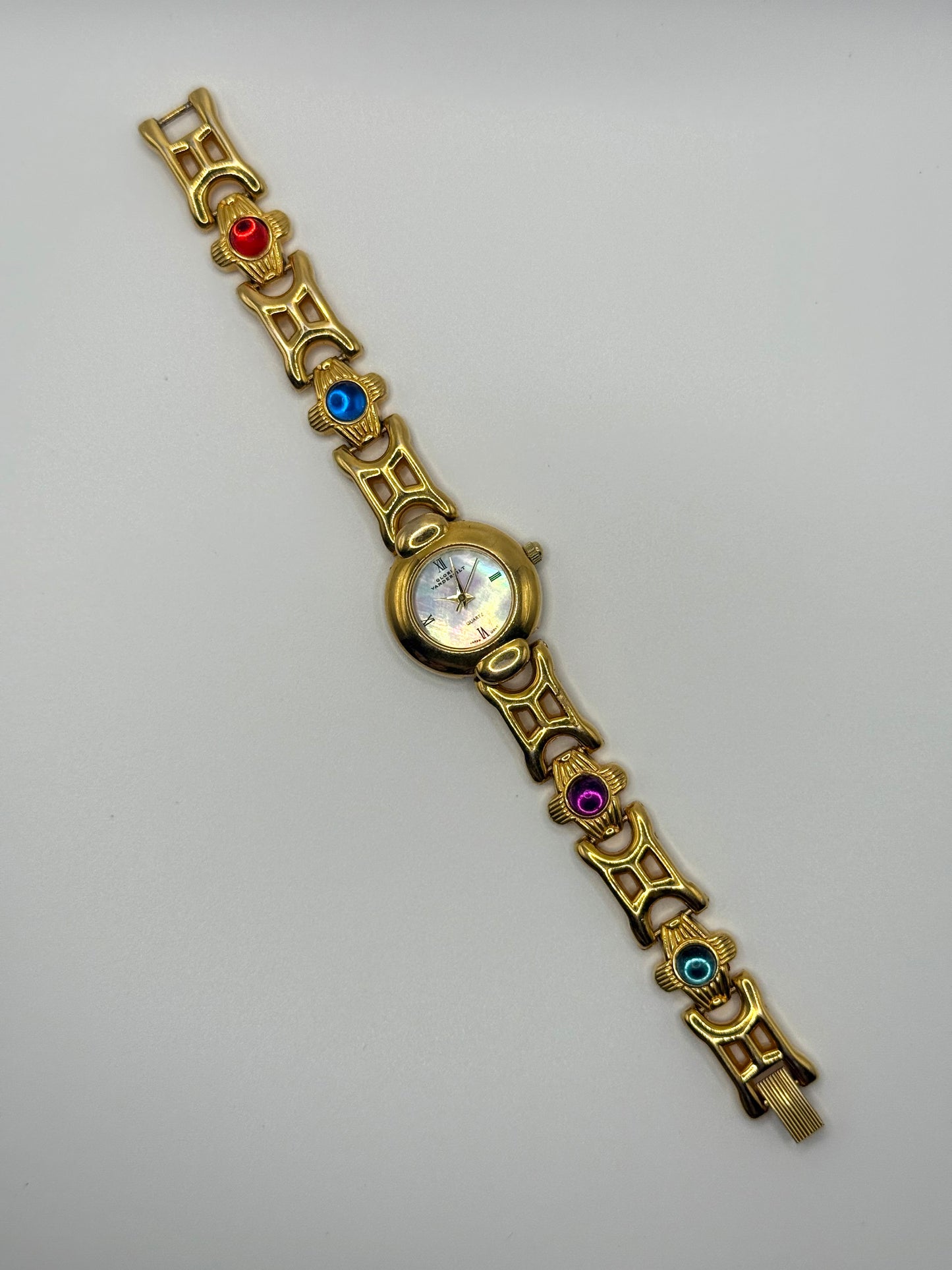 working gold tone gemstone watch