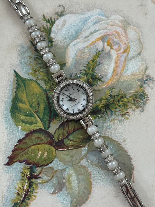 working silver tone pearl band watch