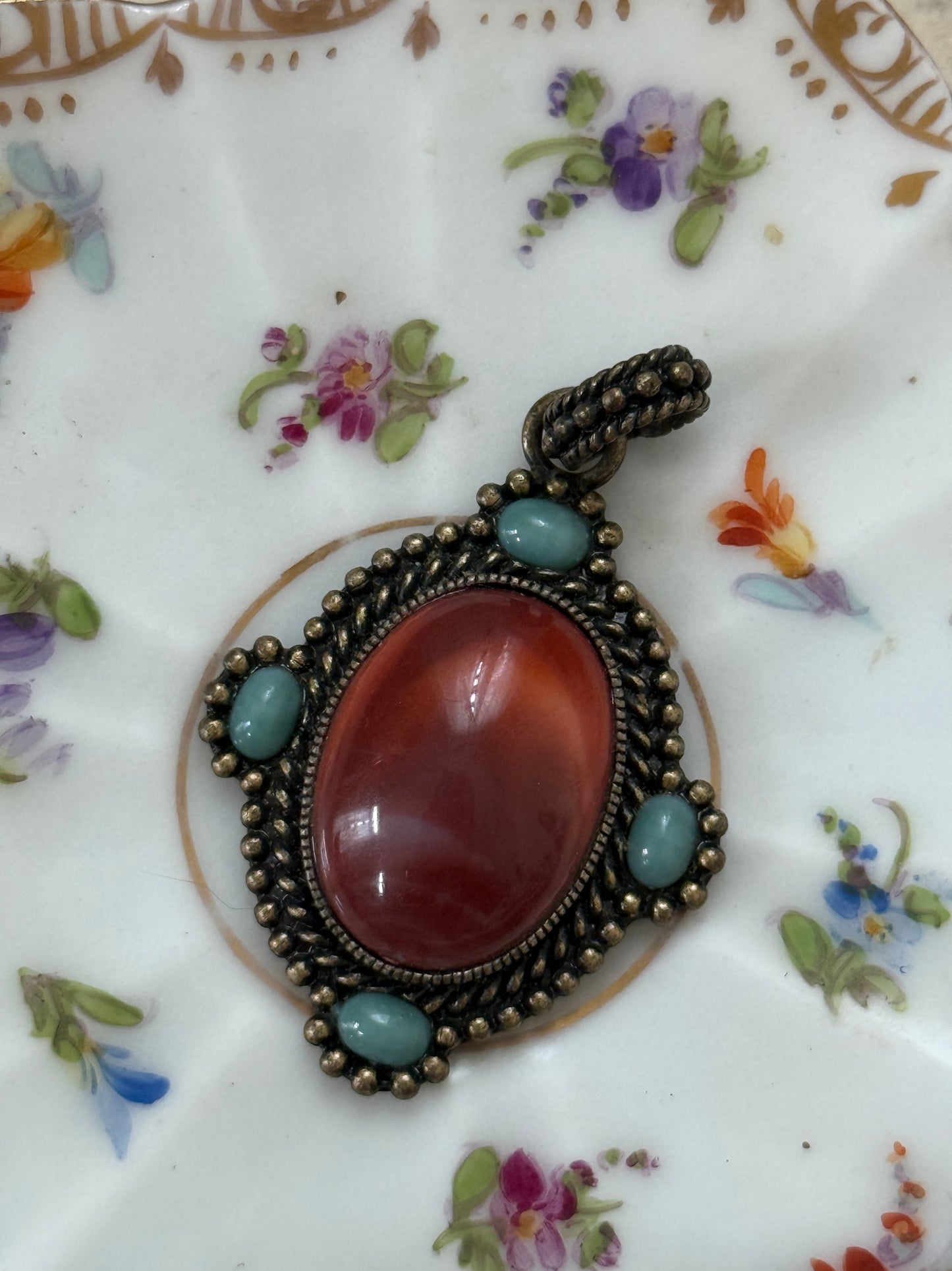 bronze tone (?) gemstone pendant