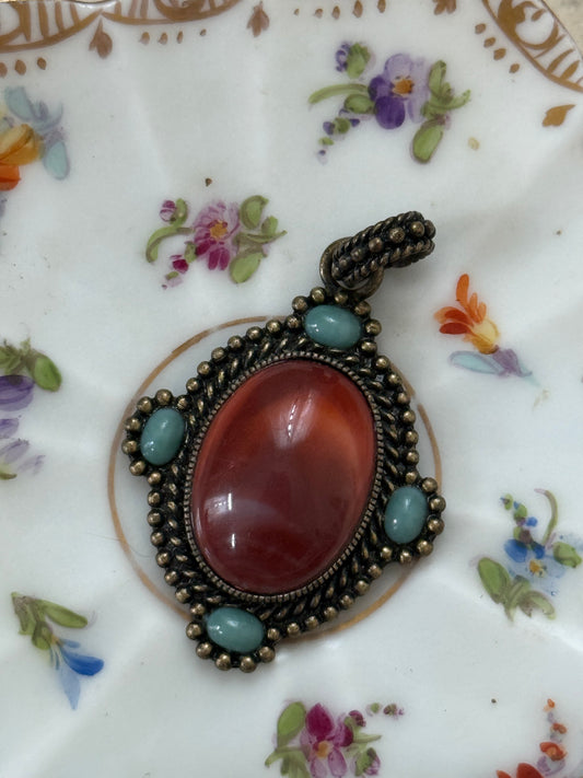 bronze tone (?) gemstone pendant