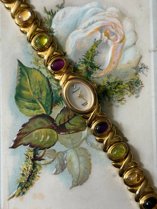 working gold tone gemstone watch