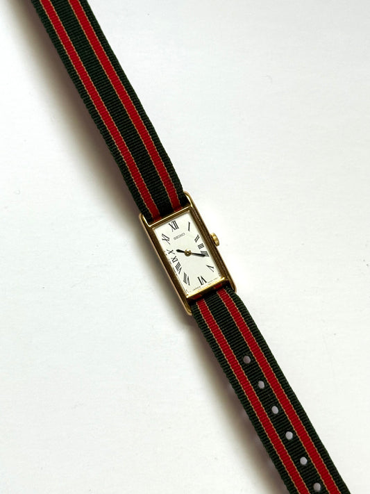 working gold tone red and green strap seiko watch