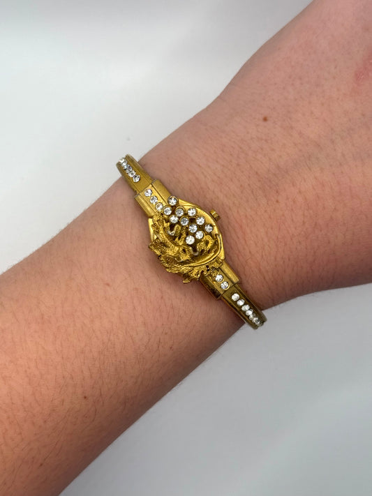 working gold tone peek a boo watch