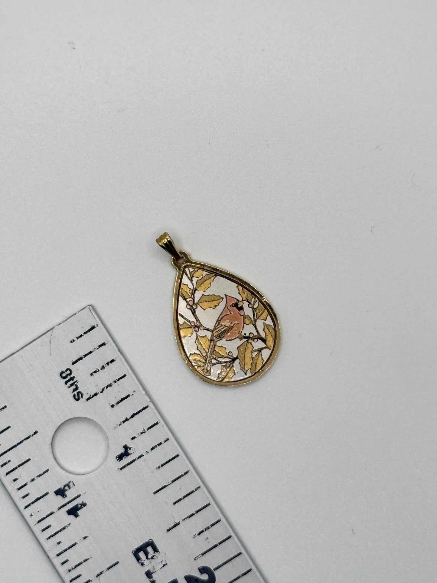 gold tone damascene robin pendant