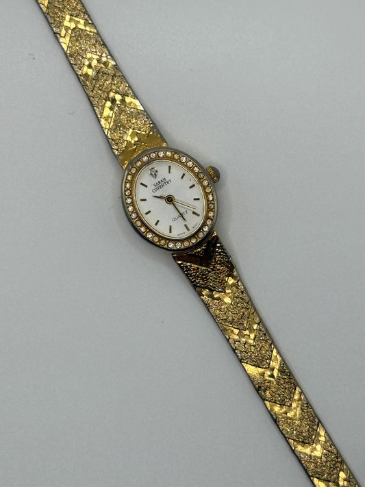 working gold tone crystal bezel watch