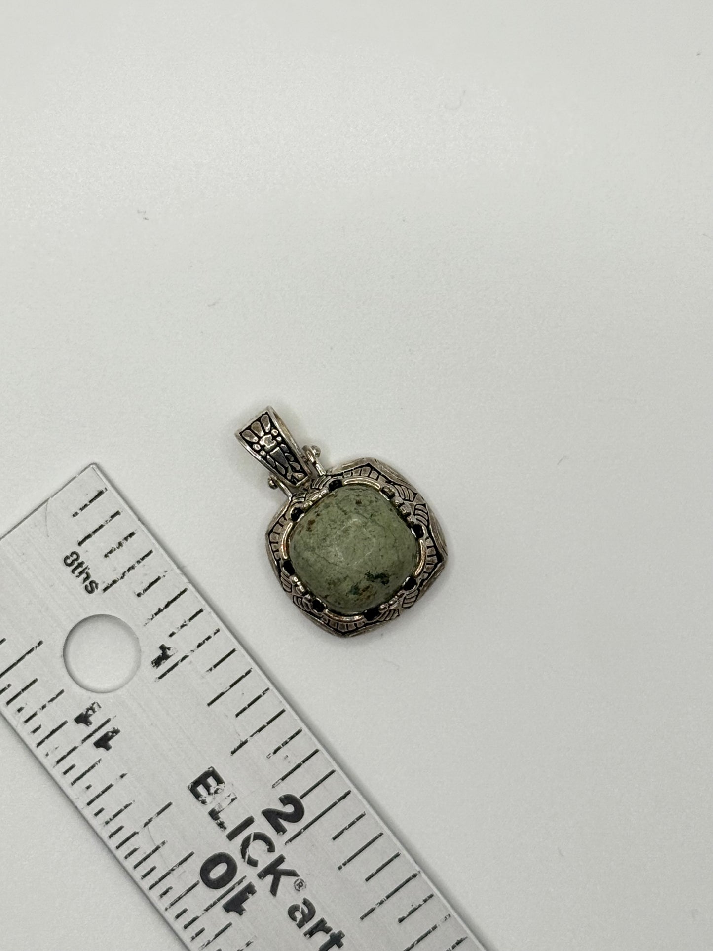 silver tone green stone pendant