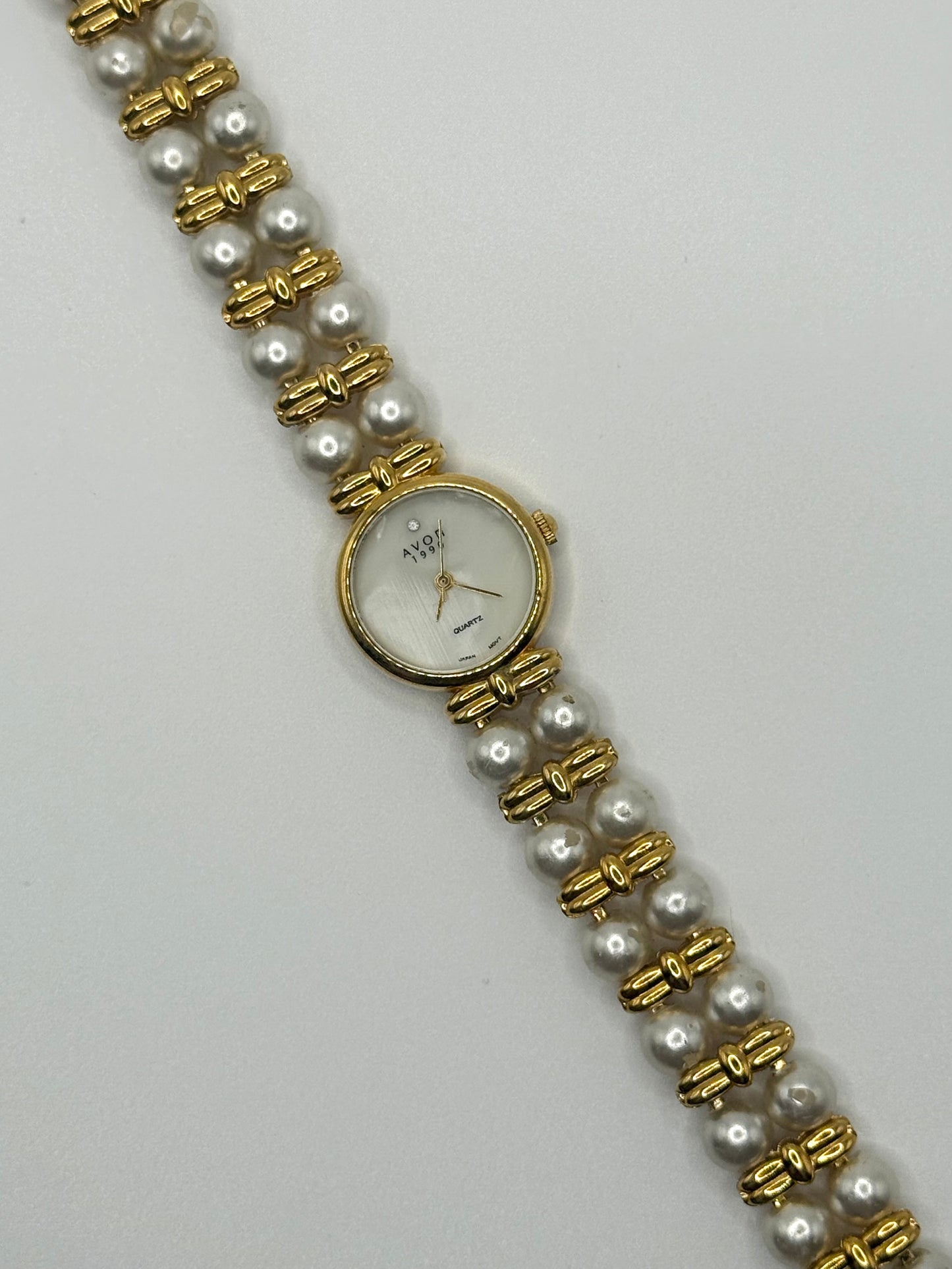 nonworking gold tone pearl band watch