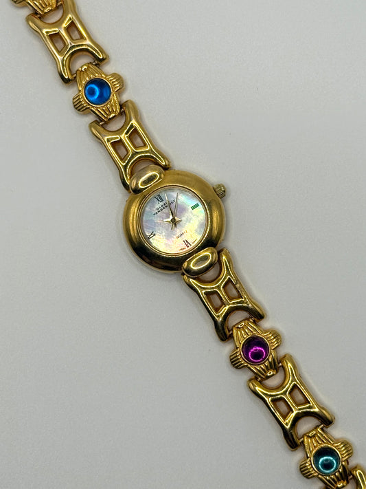 working gold tone gemstone watch