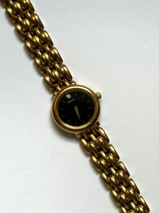 working gold tone black dial seiko watch