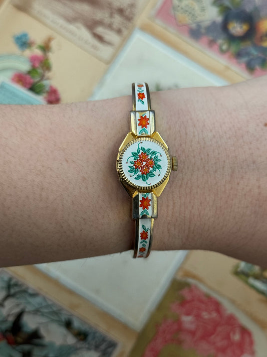 gold tone vintage floral enameled swiss made peek a boo cuff watch