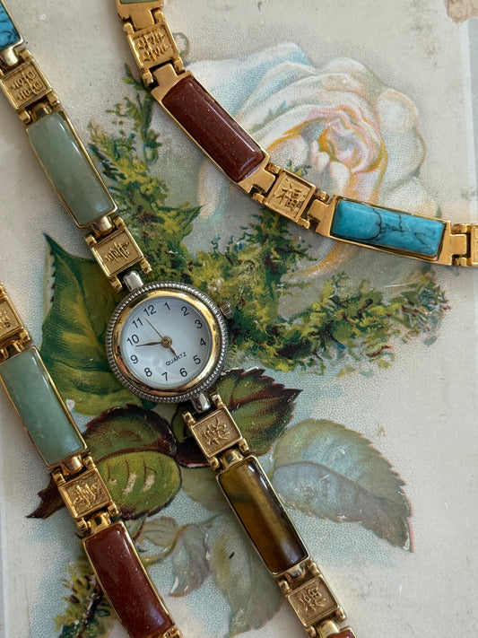 working gold tone three piece gemstone set: watch, bracelet, necklace
