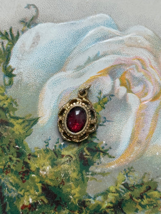 gold tone red gemstone pendant